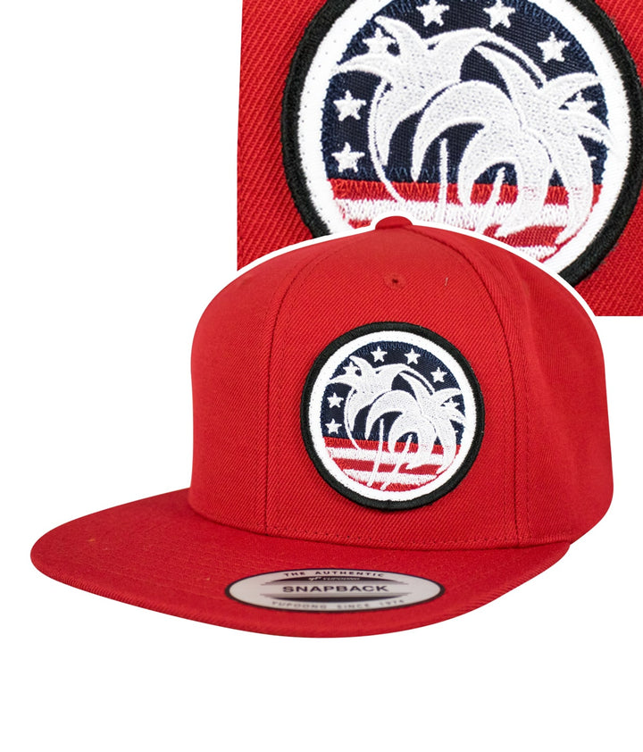 Red flatbill snapback hat featuring palm tree and patriotic patch design for stylish Americana vibe.
