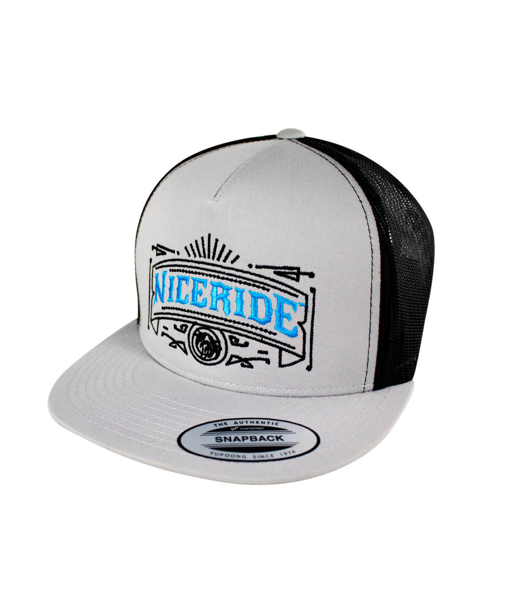 Cholo trucker hat featuring NICERIDE design in blue embroidery on a classic snapback style.
