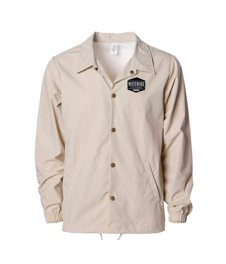Good Times windbreaker jacket with NICERIDE logo in beige color, features drawstring closure and waterproof coating. Jacket.