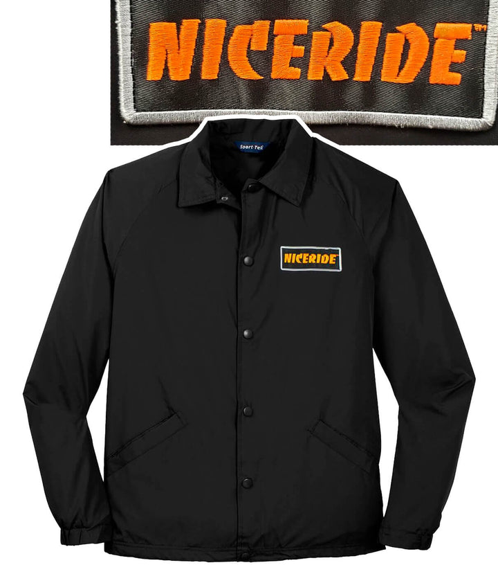 Black NICERIDE jacket with snap front closure and embroidered patch on the chest.