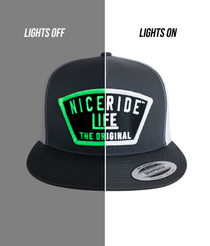 Grinder Trucker Hat showcasing NICERIDE design with lights off and on, highlighting the embroidered logo, a stylish hat.
