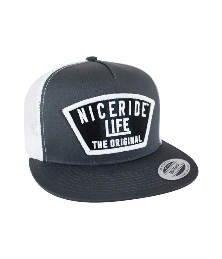 Grinder Trucker Hat with NICERIDE logo, classic snapback style, baseball cap designed in the USA, focus on hat.