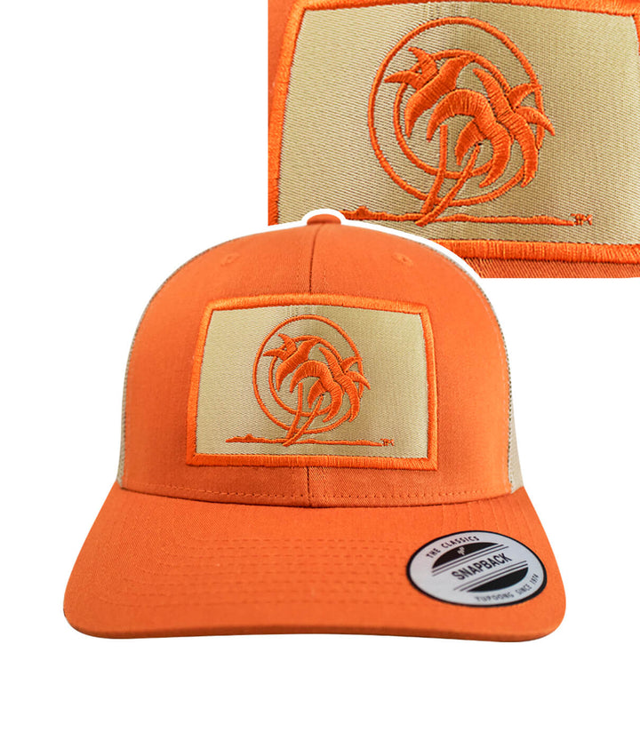 Classic Palm Patch retro trucker hat showcasing vibrant orange color and detailed palm tree embroidery.