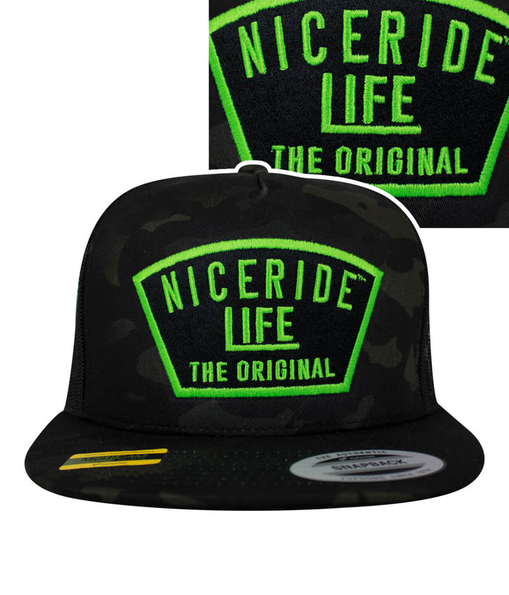 NICERIDE Life trucker hat with green embroidery, classic snapback design, and camo pattern.