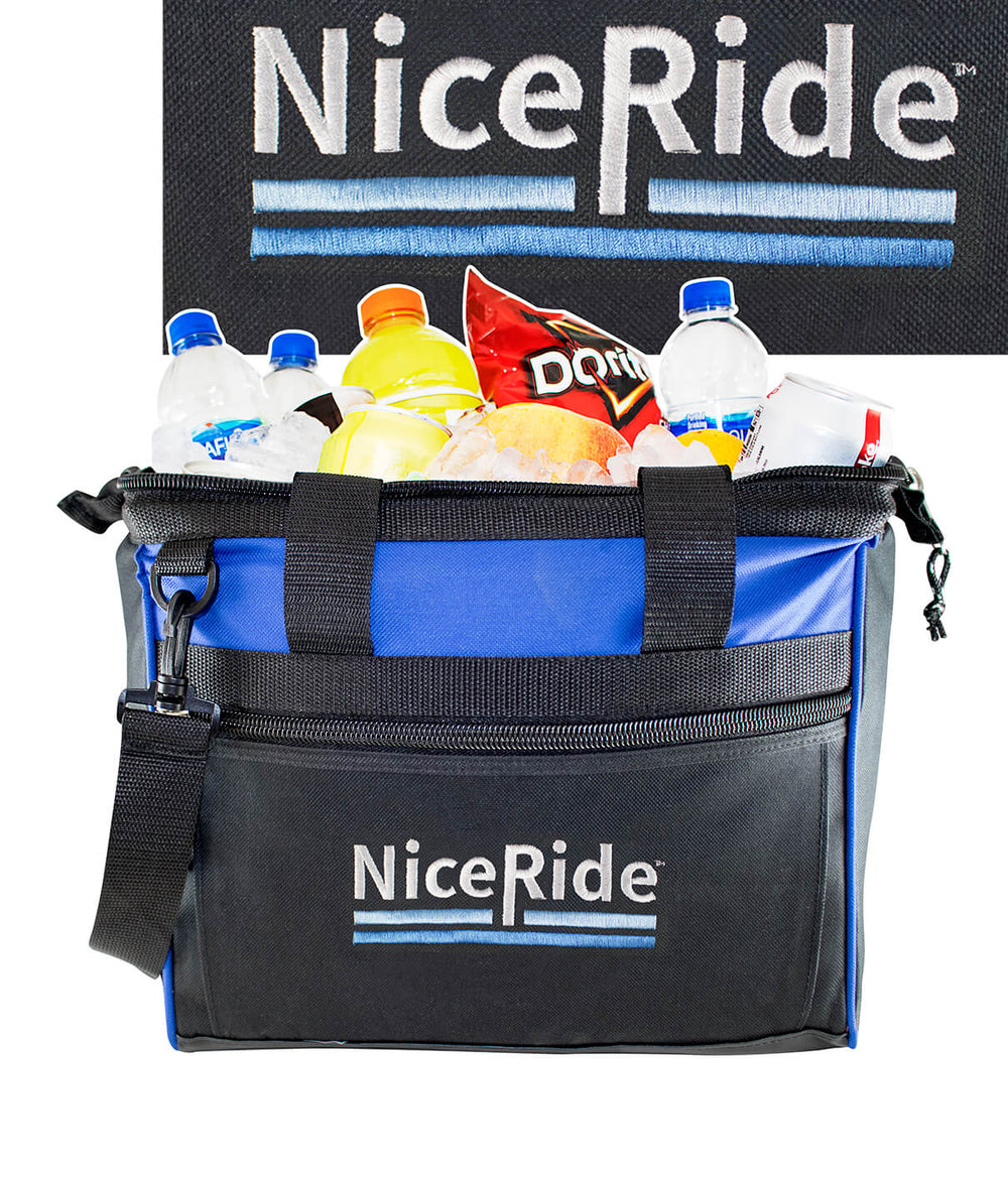 Low Tide Big Mouth cooler filled with drinks and snacks, featuring an embroidered logo, perfect for beach outings.
