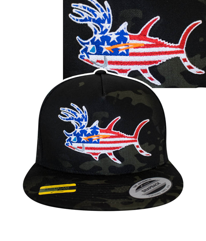 A camouflage cap with a red, white and blue fish embroidered on it.