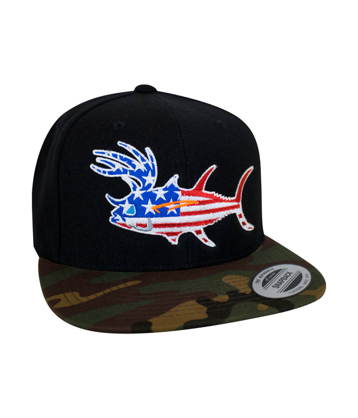 Black snapback hat with American flag fish design and camo brim, perfect for outdoor activities.