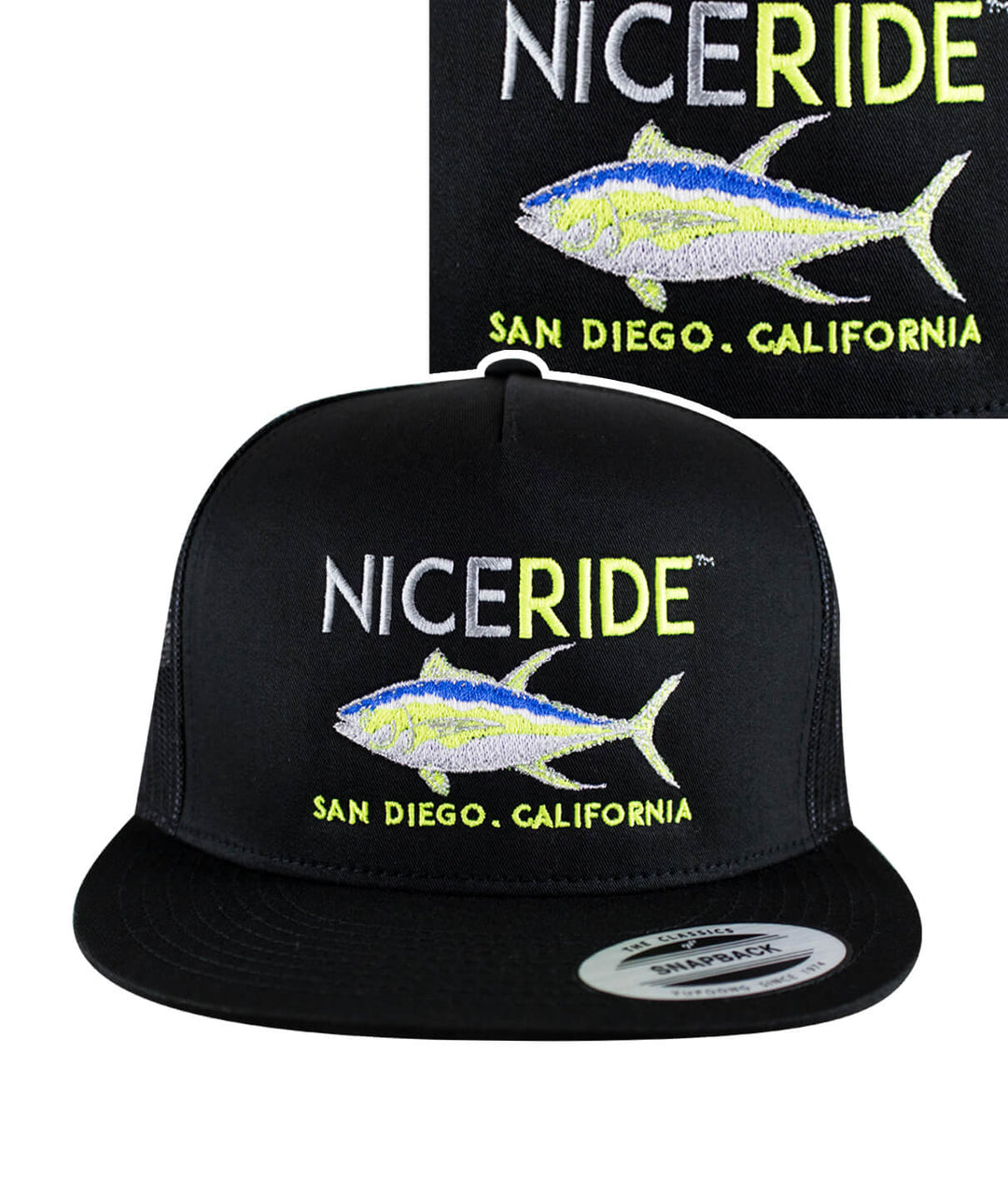 A black hat with neon green and white embroidery on it