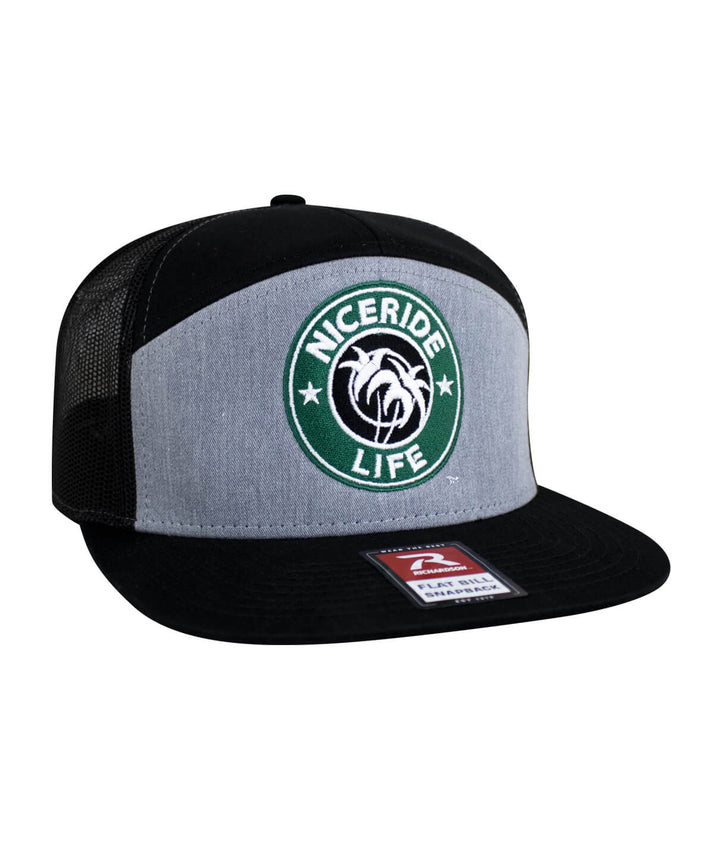 NICERIDE Life 7-panel trucker hat featuring embroidered palm logo and mesh back for stylish comfort.