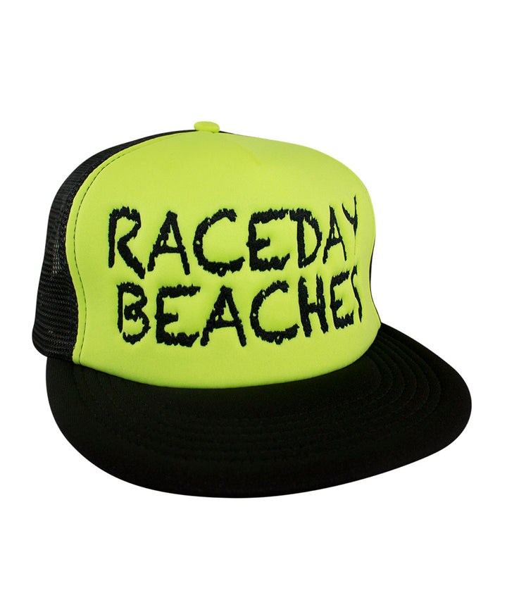 Raceday Beaches District Foam Trucker Hat in bright yellow with black mesh, featuring the word &