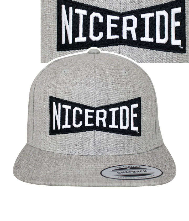 Bow Tie snapback hat featuring NICERIDE logo on front and classic palm logo on back, perfect stylish hat.
