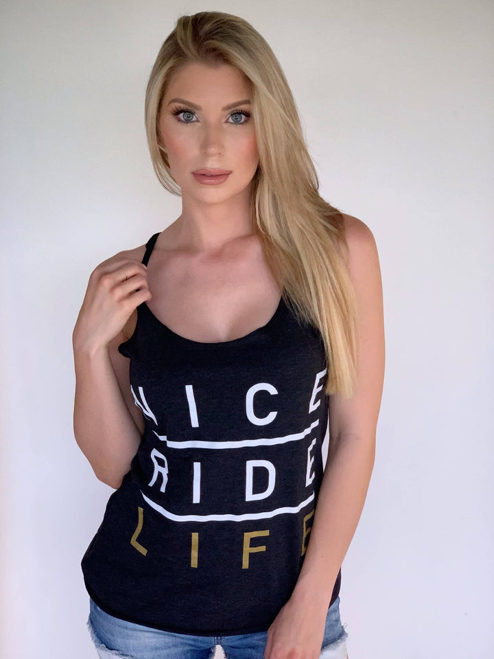 Model wearing a black tank top with &