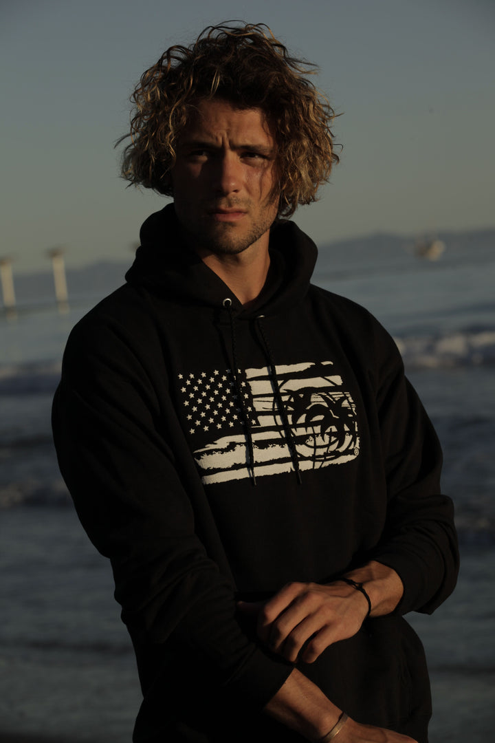 Black pullover hoodie for men and women featuring American flag and NICERIDE&