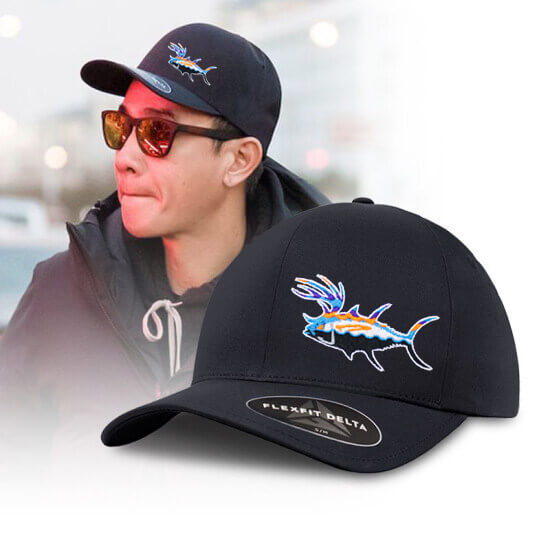 Unisex Flexfit Delta baseball cap featuring embroidered fish design, worn by a man with sunglasses.