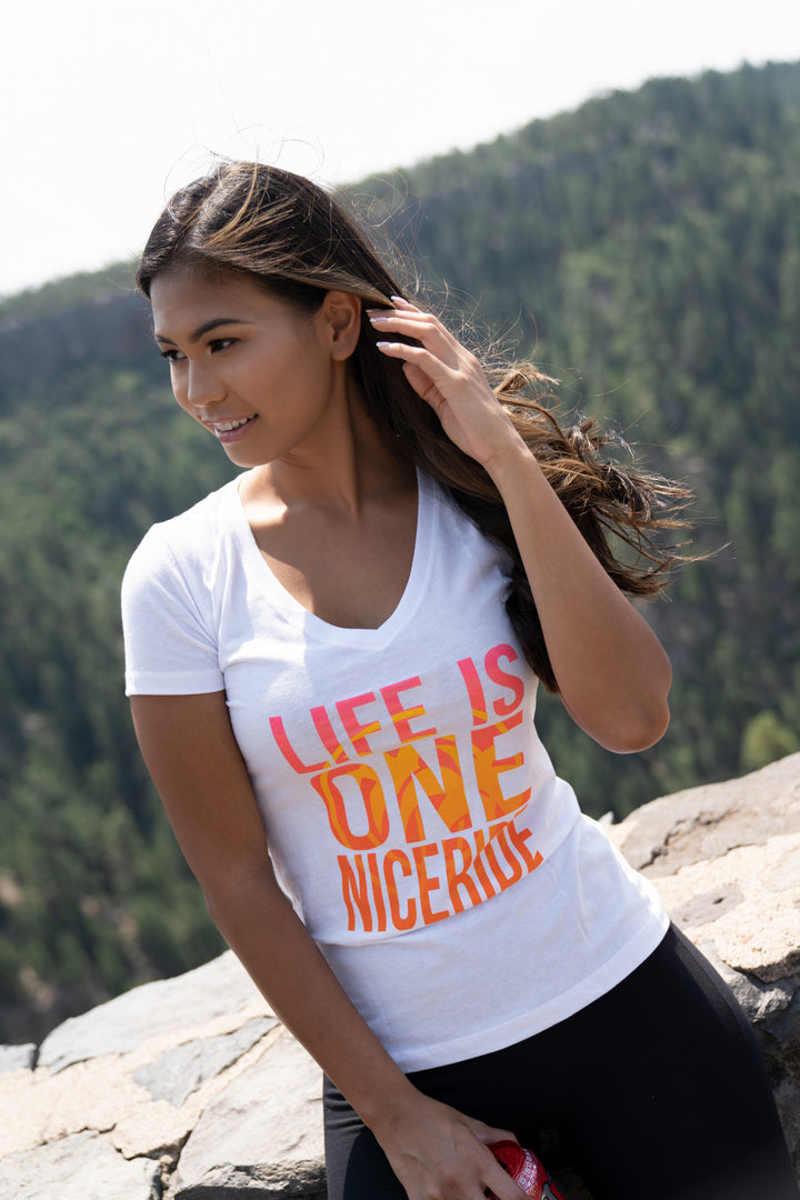 Woman wearing white tank top with &