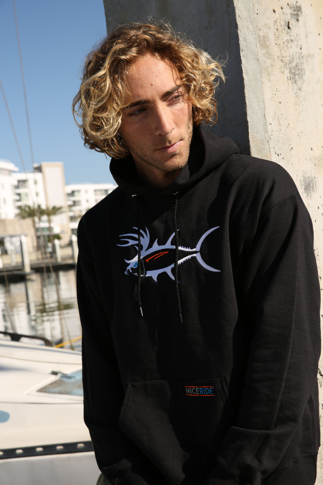 Black pullover hoodie for men and women featuring NICERIDE&